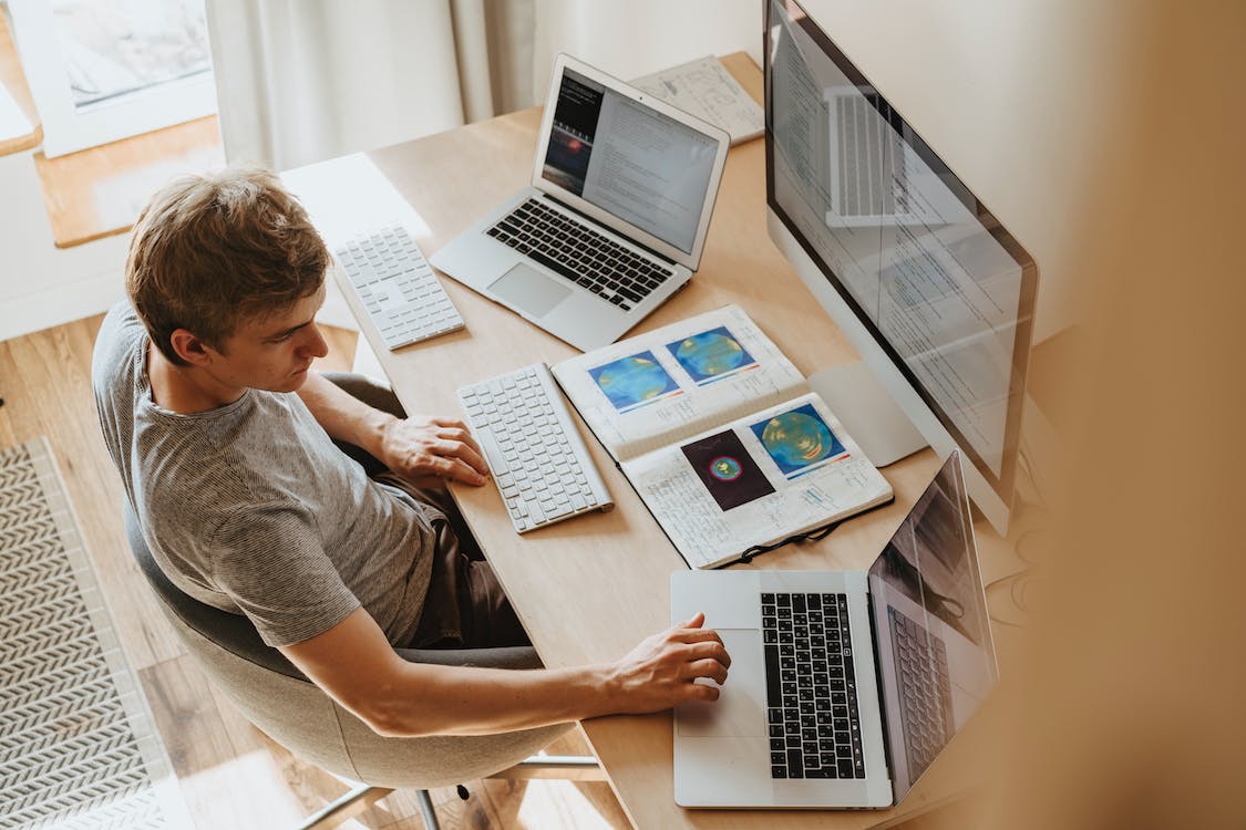 man working from home at computer desk